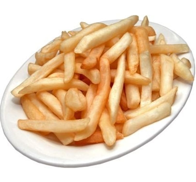 A white oval plate piled high with golden-brown french fries, against a white background.